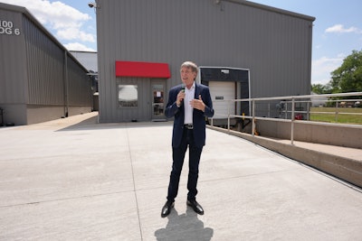 Chris Nelson, CEO of Kemin Industries, addresses participants at the opening of Kemin Nutrisurance's wet pet food pilot lab in Des Moines, Iowa, USA.