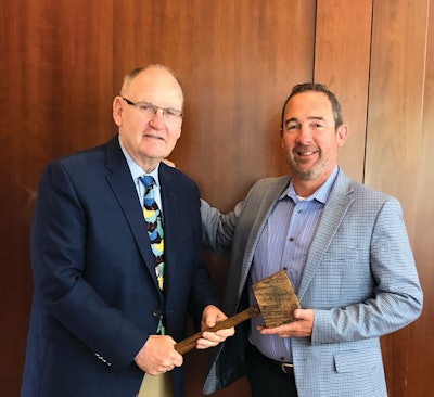 John Starkey passes the gavel to new USPOULTRY president, Nath Morris.