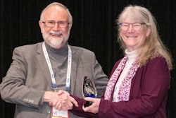Jerry May with Freshpet honors Angele Thompson with the 2023 Friend of Pet Food Award on January 30.