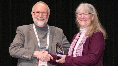 Jerry May with Freshpet honors Angele Thompson with the 2023 Friend of Pet Food Award on January 30.