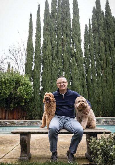 Primal Pet Group CEO Jon Balousek (here with Labradoodle Buster and Goldendoodle Beau) is at the helm of two brands sitting at the top of their respective segments in terms of longevity and innovation.