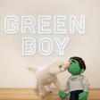 Bean, the Green Boy mascot, and his friend, Junior, celebrate the opening of Green Boy Groups Pet Food Division on April 1.