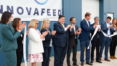 Illinois Governor JB Pritzker, center, and Decatur Mayor Julie Moore Wolfe (third from left) helped cut the ribbon on April 18.