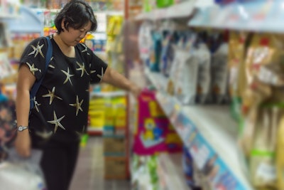 Woman In Pet Food Aisle