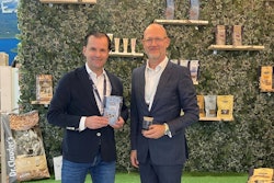 Alexander Gerards, managing partner at Dr. Clauder’s, and Herman Sloot, vice president of commercial development for Calysta, highlight the new Trainee dog snacks with fermented protein ingredients at Interzoo 2024.