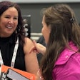Tamara Ghandour chats with an attendee during her book signing at Petfood Forum in Kansas City on Wednesday, May 1.