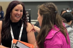Tamara Ghandour chats with an attendee during her book signing at Petfood Forum in Kansas City on Wednesday, May 1.