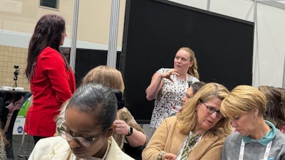 Tamara Ghandour answers an attendee's question during the Women in Petfood Leadership networking lunch on May 1.