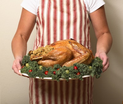 Roasted Turkey On Tray Being Held