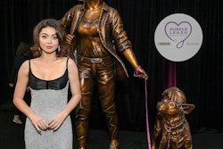 Sarah Hyland, recipient of the first-ever Variety Courage Award presented by Purina, takes in “Courageous Together” by Kristen Visbal, which was commissioned as part of the Purple Leash Project, an initiative led by Purina and the nonprofit RedRover, that aims to help more domestic violence shelters become pet friendly.