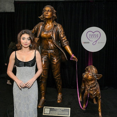 Sarah Hyland, recipient of the first-ever Variety Courage Award presented by Purina, takes in “Courageous Together” by Kristen Visbal, which was commissioned as part of the Purple Leash Project, an initiative led by Purina and the nonprofit RedRover, that aims to help more domestic violence shelters become pet friendly.