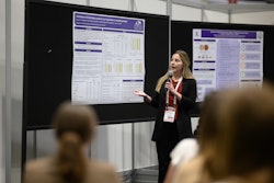 A student gives their research presentation at Petfood Forum.