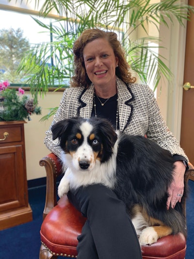 President and CEO Jaime MicKinley, here with her Miniature Australian Shepherd Noah, is helping to lead the company and its brands into a successful future with a focus on consumer connection and pet wellness.