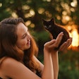Woman Holding Black Kitten Vikkibilan Pixabay