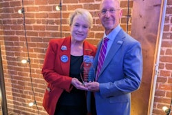 USPOULTRY Executive Vice President Gwen Venable presents the Lamplighter Award to Greg Watt, president and CEO of WATT Global Media.