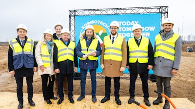 The official groundbreaking ceremony in Kėdainiai included the placement of a symbolic time capsule containing a letter from Rostyslav Vovk, chairman of the board and co-owner of the Kormotech Group of Companies.