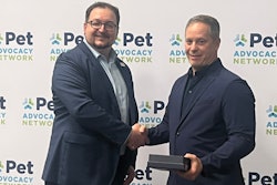 Michael Landa, Nulo Pet Food, received the Power of Pets Award from Mike Bober, president and CEO of PAN.