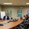 Sen. Roger Marshall, left, visits with staff members at the Cargill Innovation Center in Wichita, Kansas.