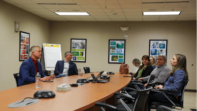 Sen. Roger Marshall, left, visits with staff members at the Cargill Innovation Center in Wichita, Kansas.