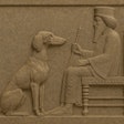 Stone Relief Carving Of A Saluki Dog Sitting At The Feet Of King Darius