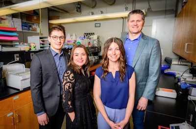 Professor and director of the Division of Nutritional Sciences Kelly Swanson, right, led a team that tested a precision-brewed chicken protein in dog kibble and found that it had gut-health benefits for dogs that consumed it during the six-month study. The team included, from left, alumnus Julio Mioto, animal sciences professor Patricia Oba and alumna Meredith Smola, the first author of the study.
