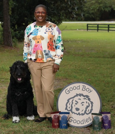 Good Boy Goodies founder ArrKeicha Danzie, pictured here with company mascot Mr. Chubb, is carving a unique path in pet treats by targeting innovative retail spaces, including airport concourses, rest stops, specialty boutiques and farmers markets.