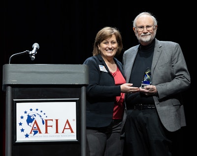 Jerry May was presented with the AFIA Friend of Pet Food Award by AFIA president and CEO Constance Cullman.