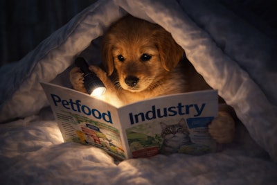 A Puppy Is Reading A Copy Of The Magazine Petfood Industry Under The Blankets In Her Room