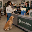Woman Buying Pet Food With Golden Retriever Chat Gpt