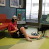 St. Louis Children's Hospital patient William Petla with his dog Bristol in Purina Family Pet Center.