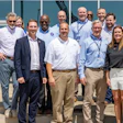 Simmons Foods personnel stand with Arkansas Gov. Sarah Huckabee Sanders.