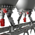 Dinnissen industrial bulk handling system with multiple spherical storage vessels and red mechanical components on support frame