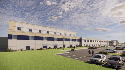 Modern industrial warehouse facility with multi-story design, parking area, and landscaped grounds under cloudy sky