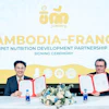 Two men sign partnership agreement at Cambodia-France pet nutrition development signing ceremony