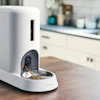 The Smart Feeder for Cats uses sensor technology and a built-in camera to identify up to five individual cats through facial recognition.