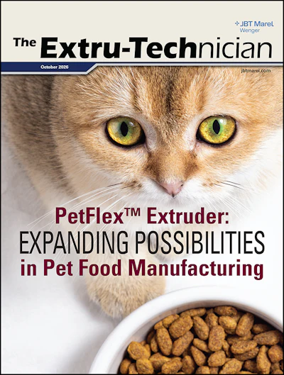 Orange tabby cat with striking yellow-green eyes gazing at a white bowl of pet kibble on magazine cover