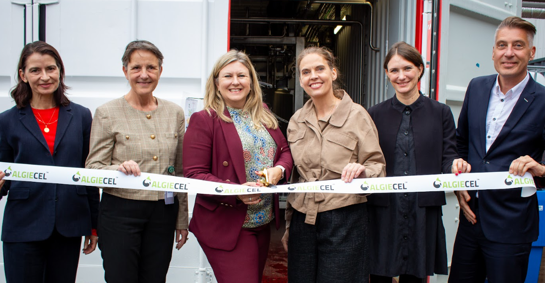 Six professionals at AlgiCEL ribbon-cutting ceremony in front of facility entrance