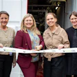 Six professionals at AlgiCEL ribbon-cutting ceremony in front of facility entrance