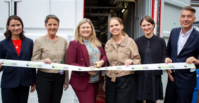 Six professionals at AlgiCEL ribbon-cutting ceremony in front of facility entrance