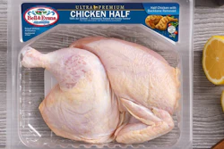 Bell & Evans Ultra Premium chicken half package with raw poultry on wooden surface