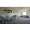 Modern veterinary clinic waiting room with Purina Pro Plan Veterinary signage and contemporary furniture
