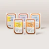 Five SMALLS cat food packaging containers displaying fresh poultry varieties in brown and colorful label designs