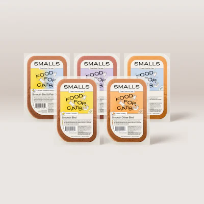 Five SMALLS cat food packaging containers displaying fresh poultry varieties in brown and colorful label designs